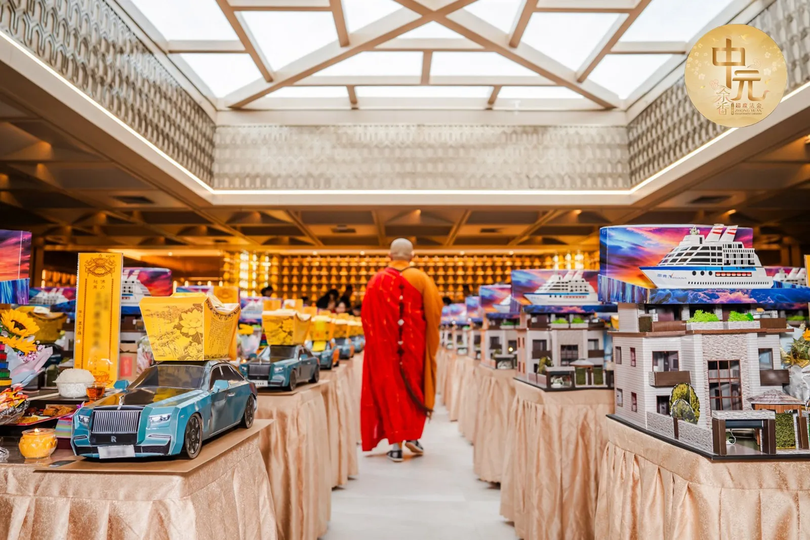 A Buddhist monk among ceremonial offerings in the prayer hall